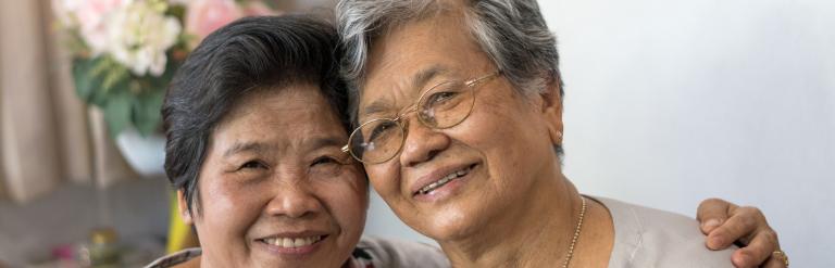 Two women with warm smiles 